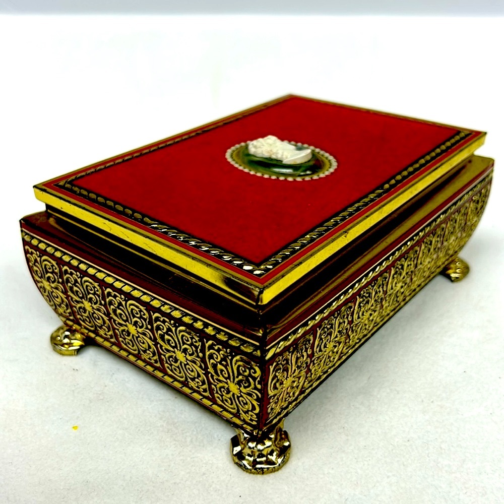 Vintage   Hinged lid tin confectionary box with red velvet and faux cameo top